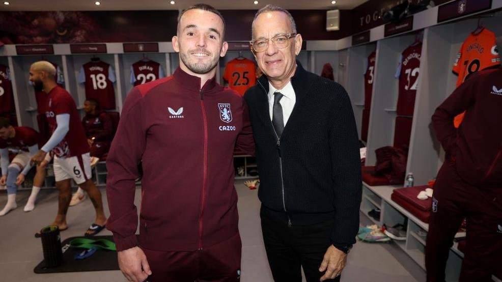 Aston Villa player John McGinn with Tom Hanks