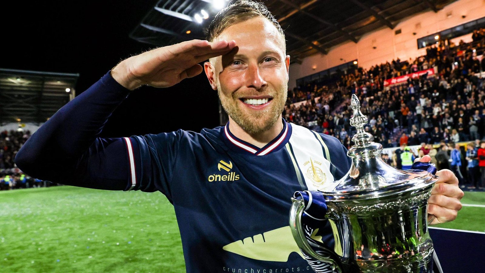 Falkirk’s Scott Arfield celebrates with the William Hill Championship Trophy during a William Hill Championship match between Falkirk and Hamilton Academical at the Falkirk Stadium