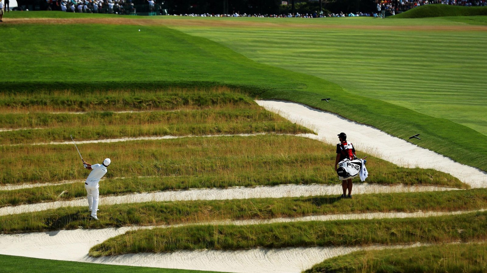 Andrew Landry playing out of the 'Church Pews' bunker during the 2016 US Open