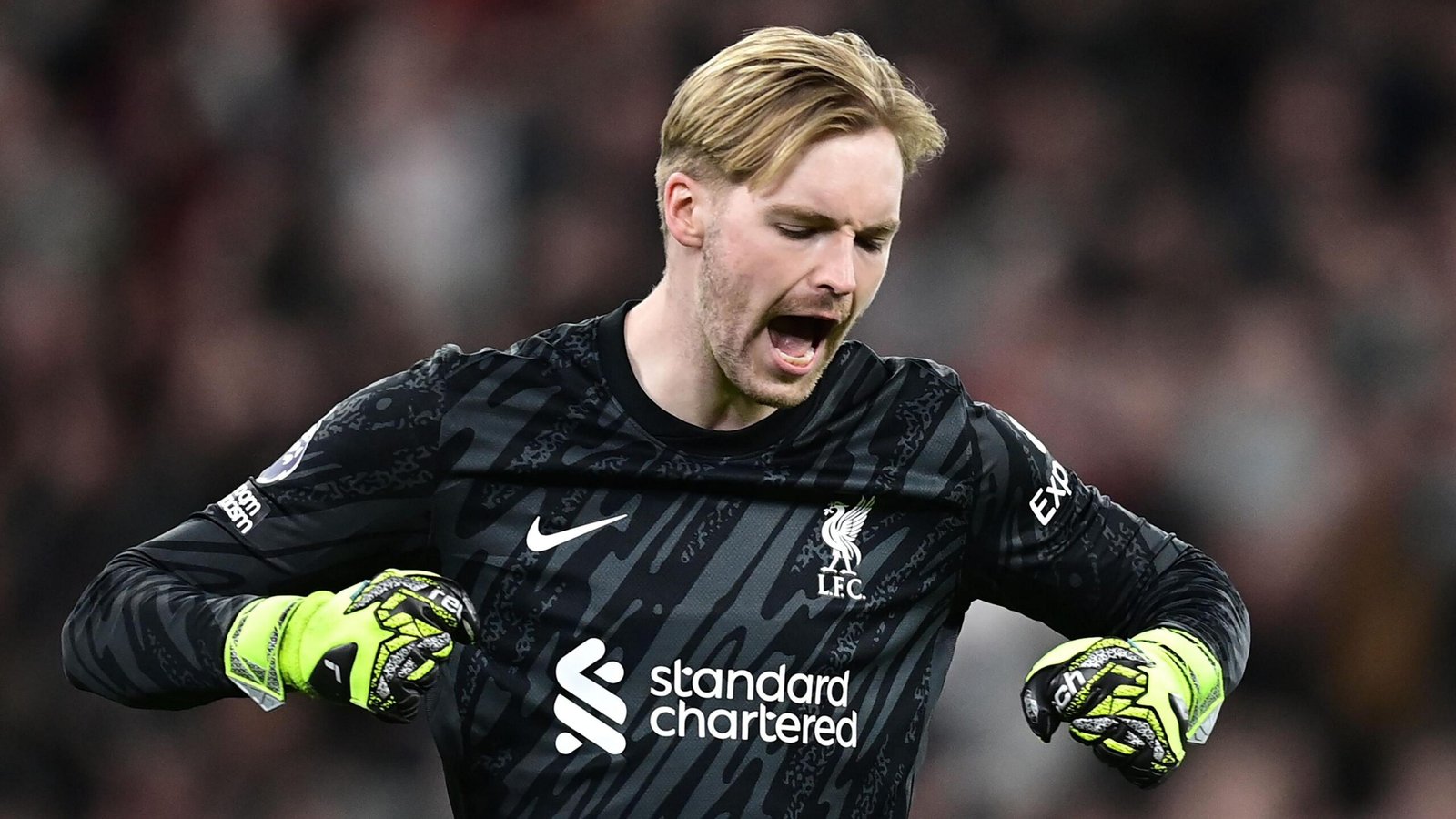 Caoimhin Kelleher celebrates a win for Liverpool