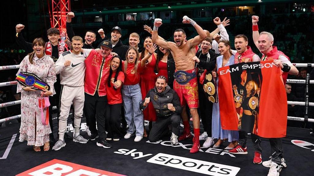 Callum Simpson celebrates with his family in the ring