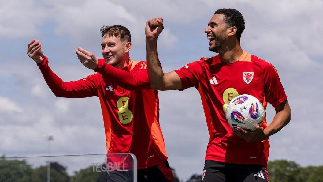 David Brooks and Ben Cabango smiling during Wales training