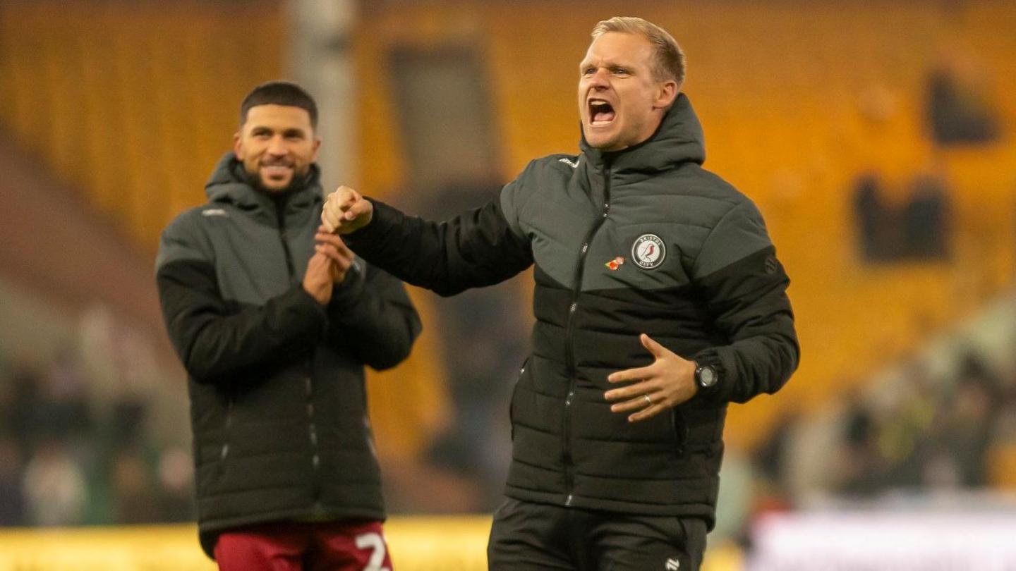 Liam Manning celebrates Bristol City's win at Norwich in November 2024